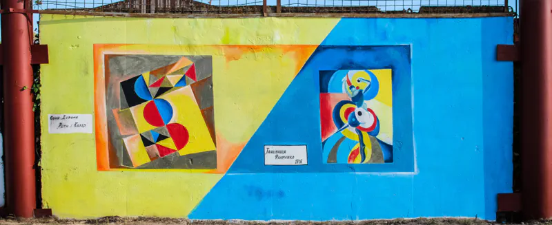 A wall painting in Berdyansk showing various geometric shapes with vibrant colors.