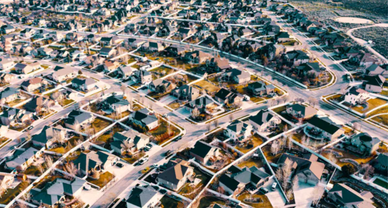 Low-rise residential buildings in a suburban area with fewer surrounding structures, daylight view.